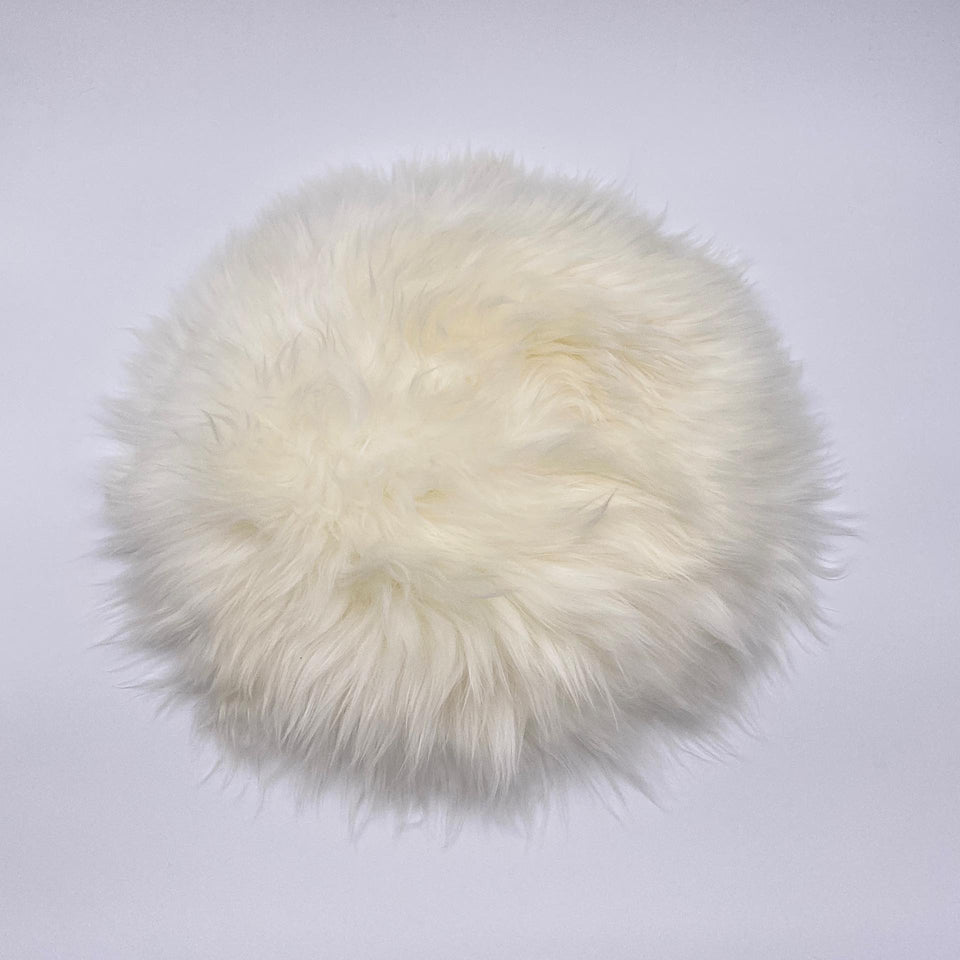 Lammfell Sitzkissen rund naturweiß
