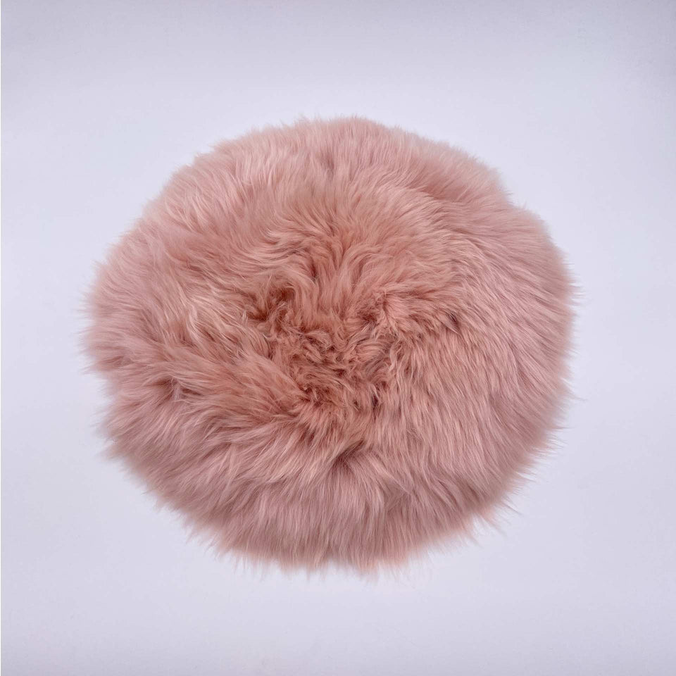 Lammfell Sitzkissen rund altrosa Aufsicht